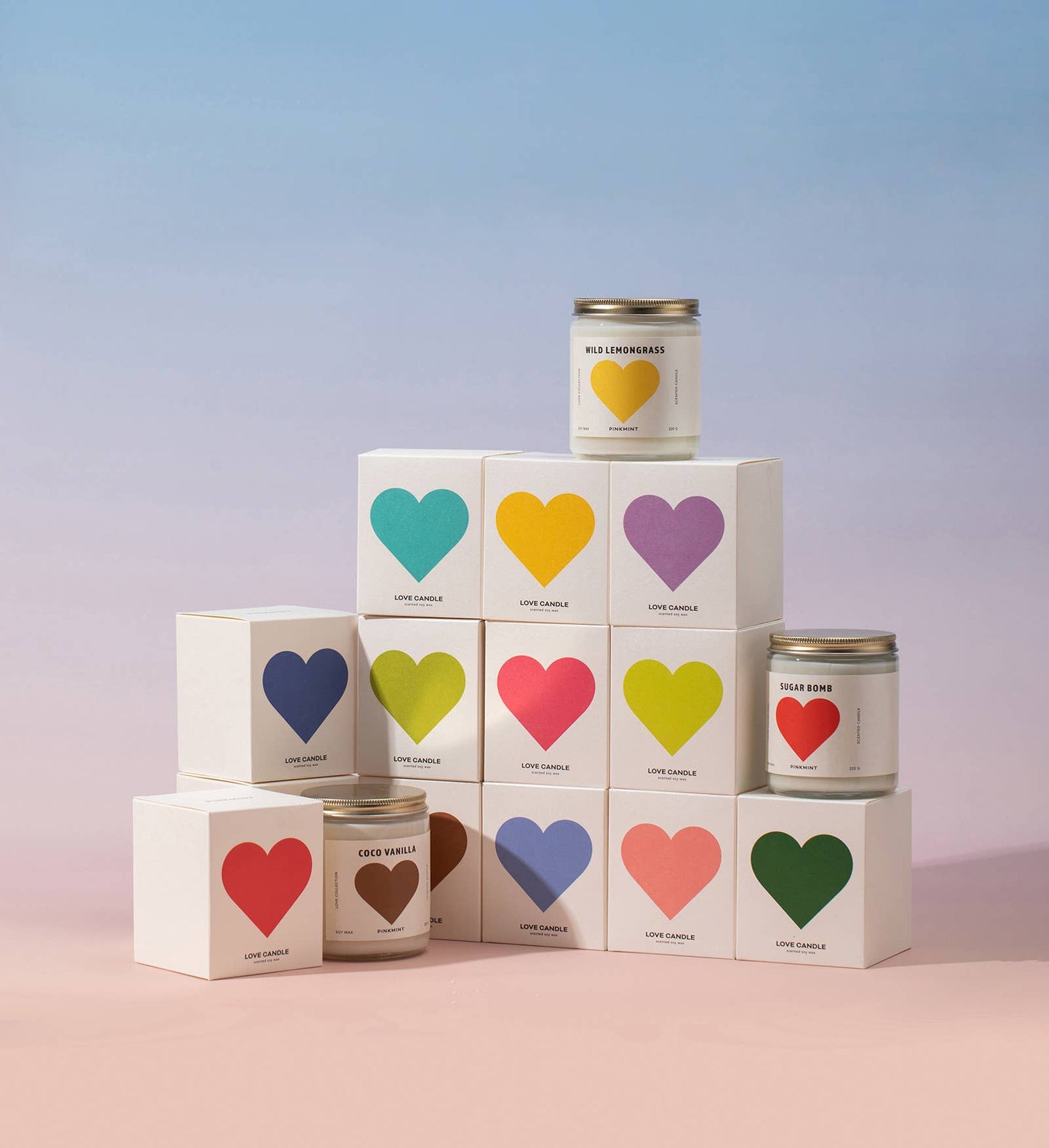 Candle tins with colorful heart labels on a gradient background