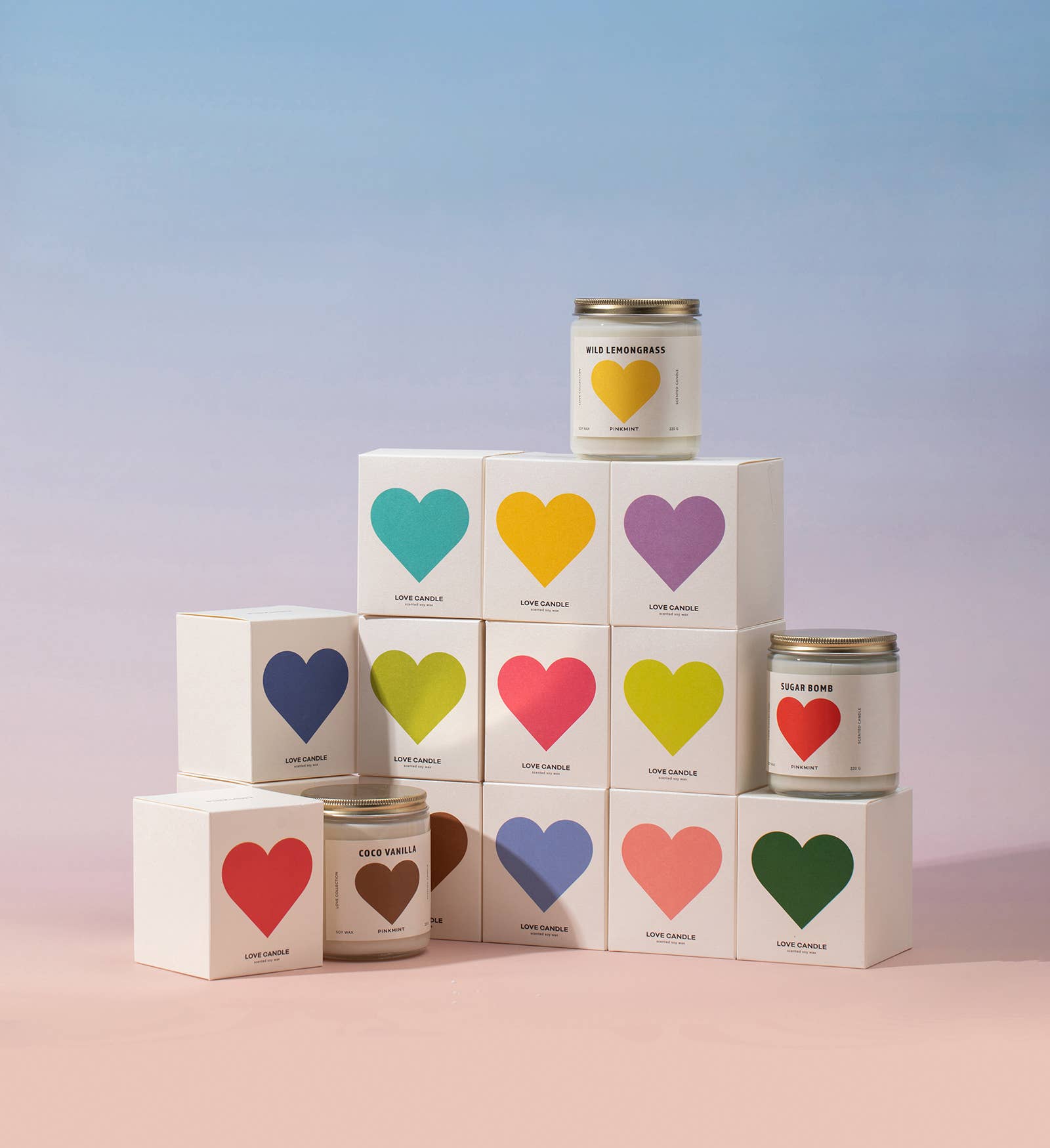 Candle tins with colorful heart labels on a gradient background