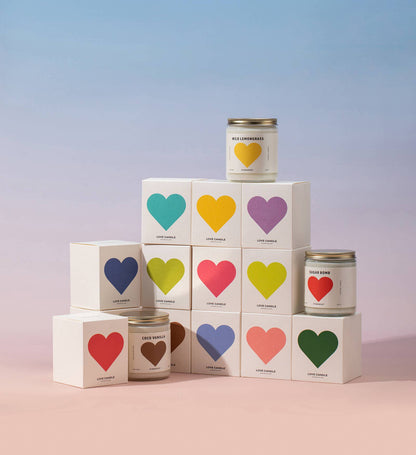 Candle tins with colorful heart labels on a gradient background