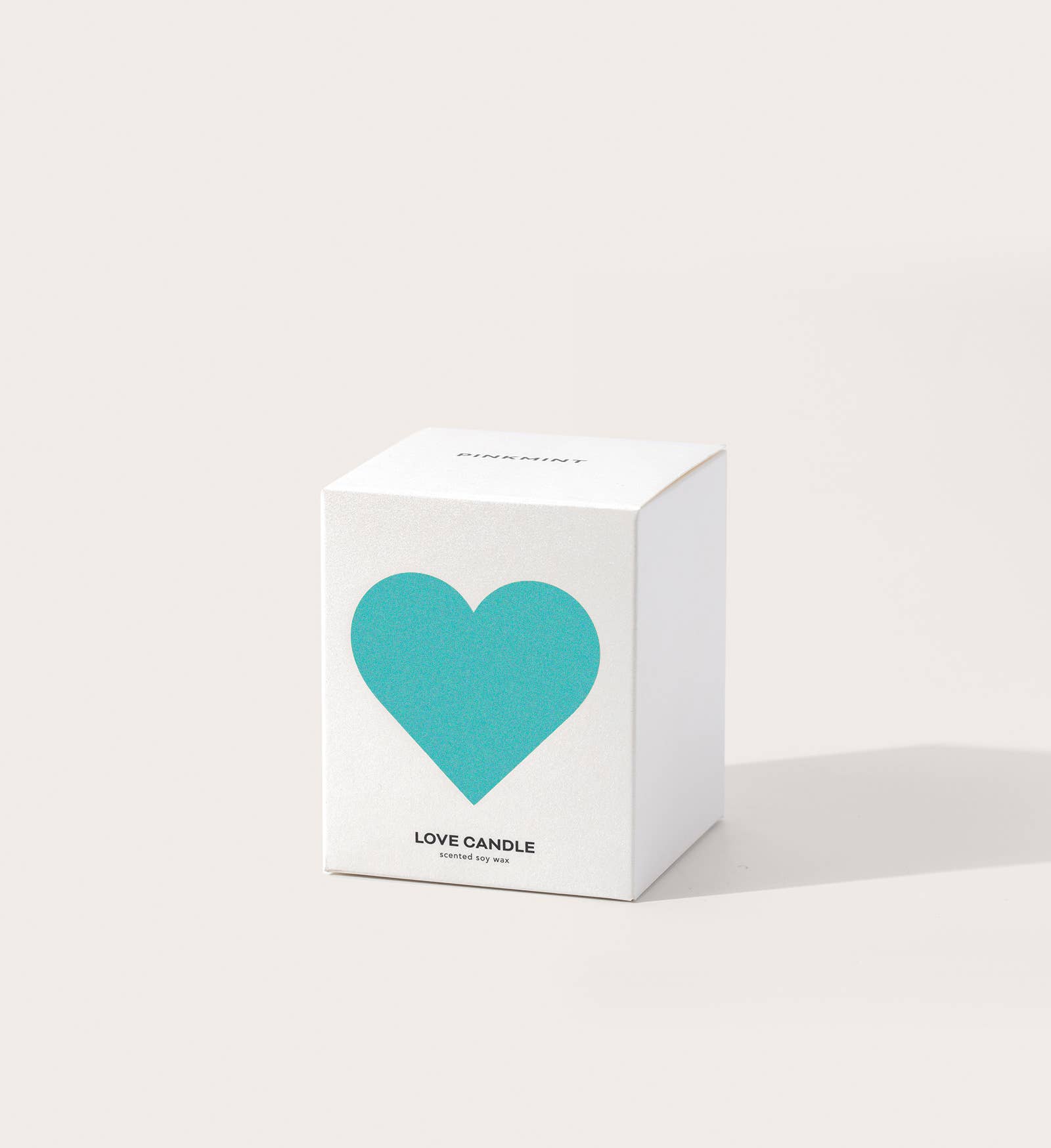 White box with a turquoise heart and 'Love Candle' text on a white background
