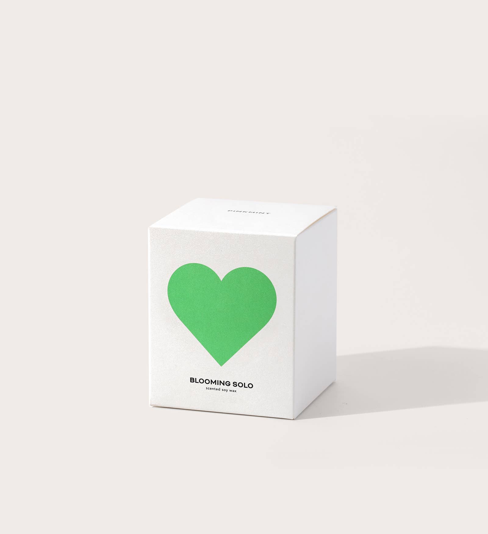 White box with a green heart and 'Blooming Solos' text on a light gray background