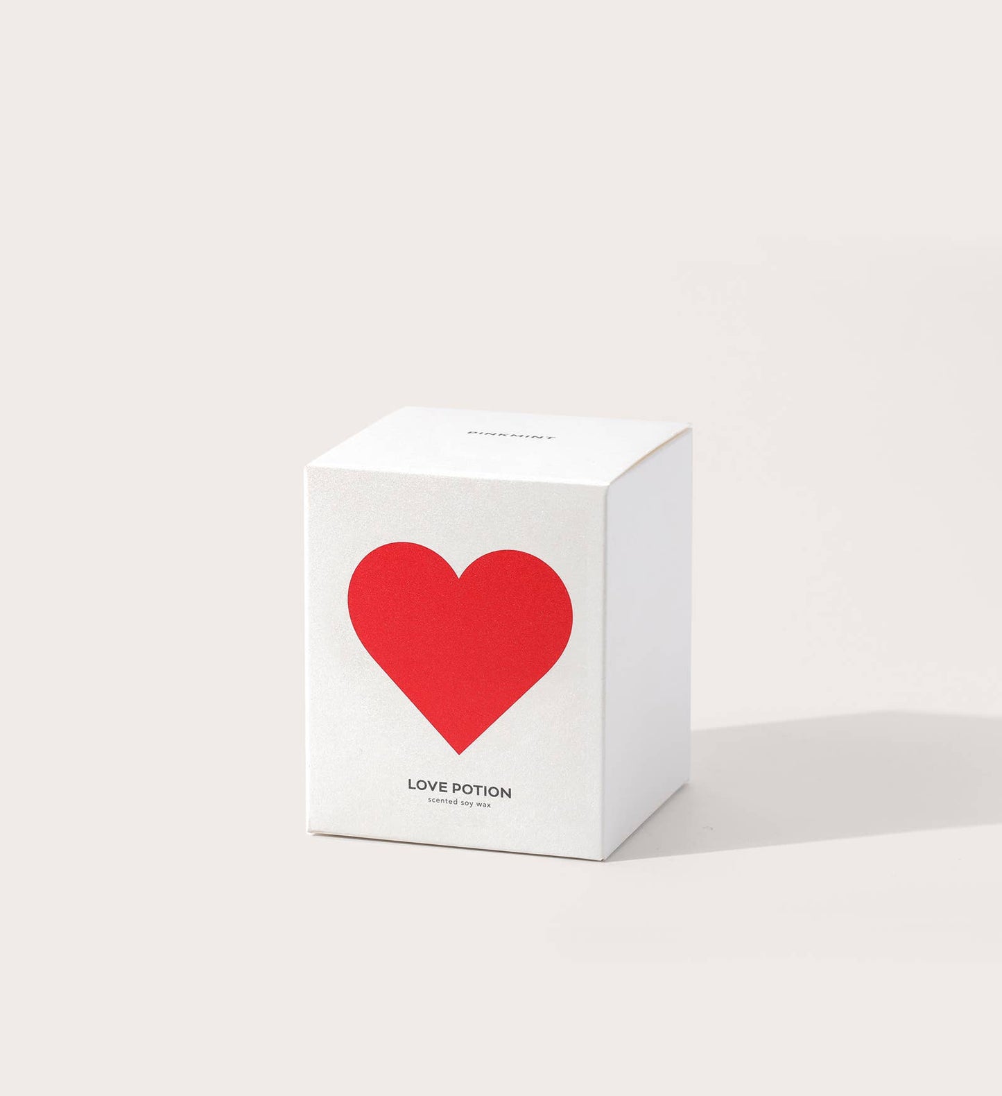 White box with a red heart and 'LOVE POTION' text on a light gray background